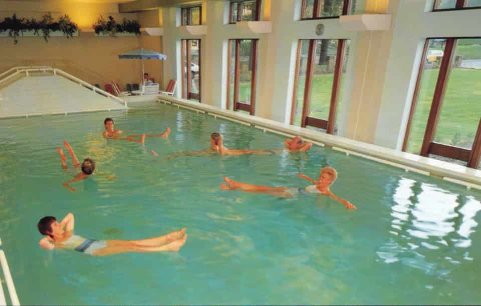 People bathing in private hospital pool